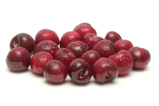 Ripe cherries on white background