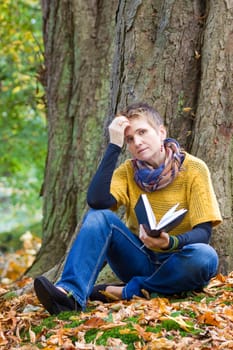 Woman reading book in the park