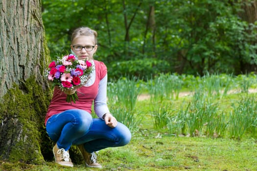 portrait of a cute young girl with flowers