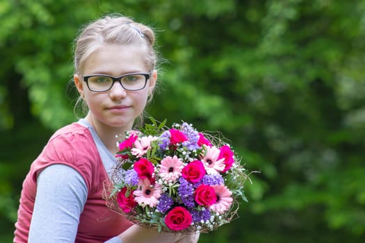 portrait of a beautiful young girl with flowers