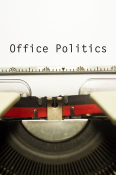 office politics, message on typewriter for conceptual background.