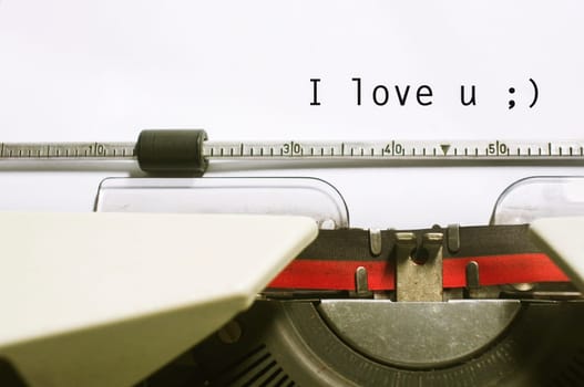 a close up of typewriter, focus on paper where message will be typed.