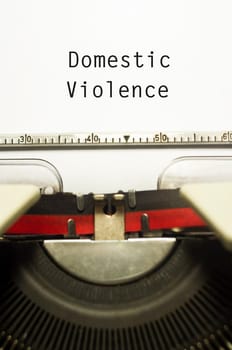 domestic violence concept, with message on typewriter paper.