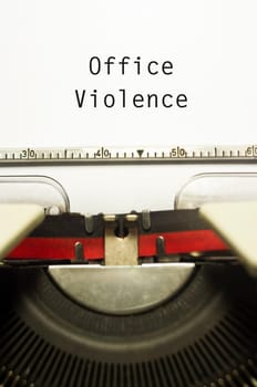 office or workplace violence, with message on typewriter paper.
