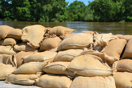 Sandbags as squatting water protection on the Elbe near Magdeburg