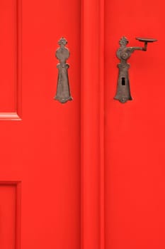 Red door with metal handle, retro style