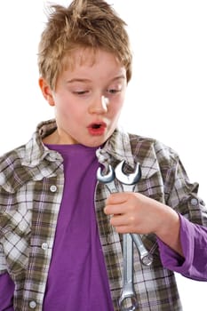 Boy with wrench is amazed