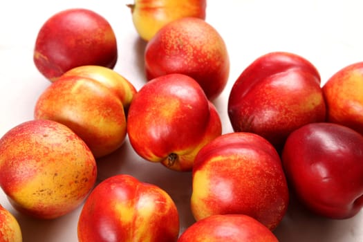 Lots of Nectarines on the kitchen table background