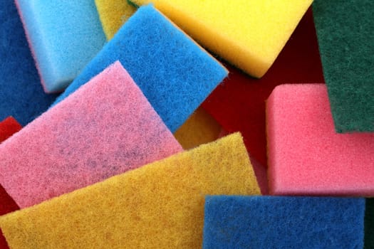 A lot of sponges in different colors background