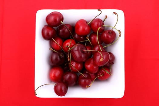 Lots of cherries in a bowl