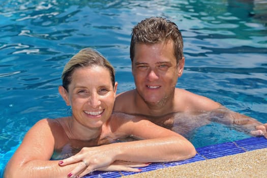 happy young  couple at summer vacation have fun and relax at beautiful sunny  day on beach