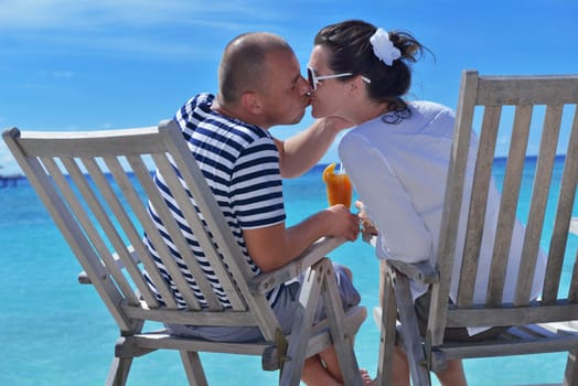 happy young couple relax and take fresh drink at summer vacation