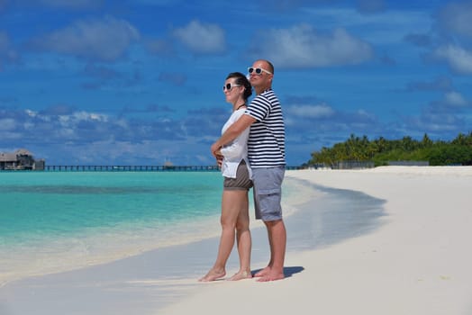 happy young couple relax and take fresh drink at summer vacation