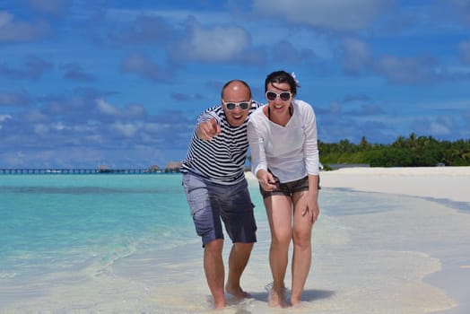 happy young couple relax and take fresh drink at summer vacation