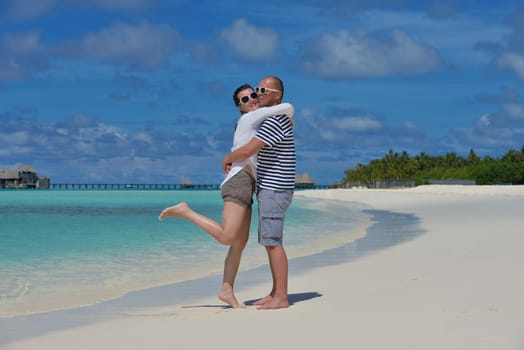 happy young couple relax and take fresh drink at summer vacation