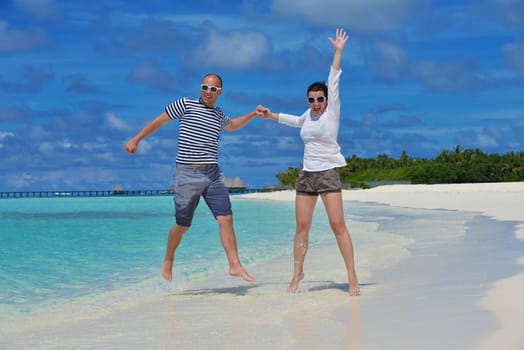 happy young couple relax and take fresh drink at summer vacation