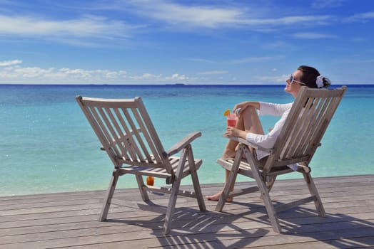 happy young couple relax and take fresh drink at summer vacation