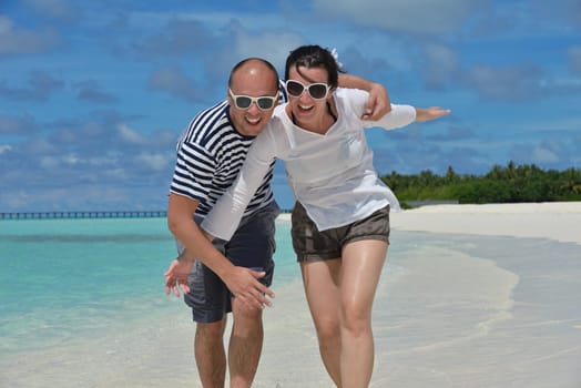 happy young couple relax and take fresh drink at summer vacation