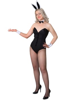 A girl dressed as a rabbit shows something isolated on white background