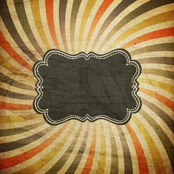 Grunge colorful rays background with vintage label for text.