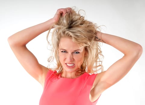 young woman pulls out her hair