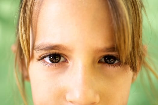 Young people and emotions, portrait of serious girl looking at camera. Closeup of eyes