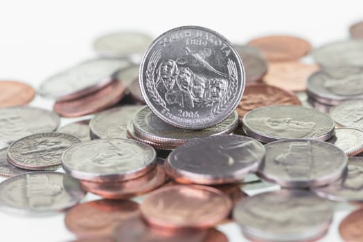 South Dakota State Quarter with other coins extreme close up