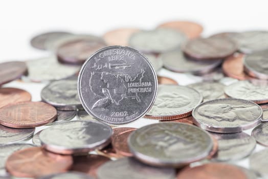 2002 Louisiana State Quarter with other coins extreme close up