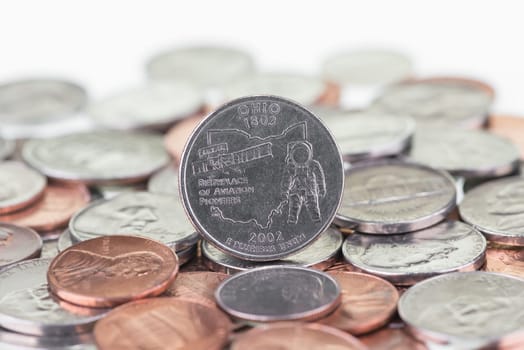 2002 Ohio State Quarter with other coins extreme close up