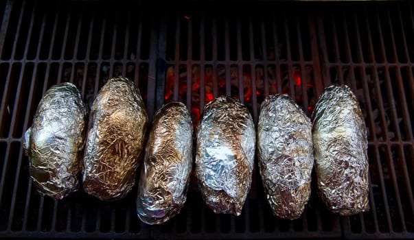 grilled whole potatoes with foil delicious meal and embers