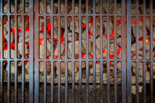 barbecue embers glowing in red fire