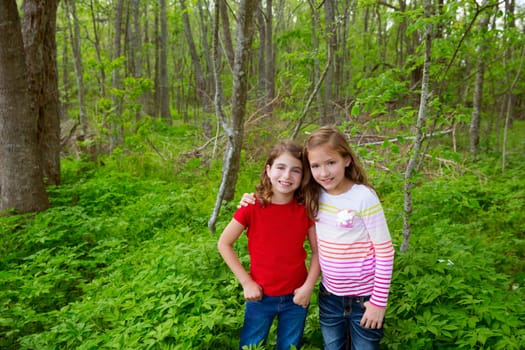 children sister friends playing relaxed on the jungle park forest outdoor