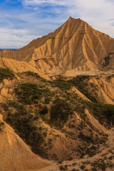 Desert landscape under the cloudy sky, Bardenas Reales, Navarra, Spain