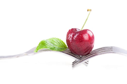 ripe cherry on a fork