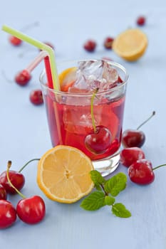Homemade lemonade with fresh lemons and cherries