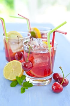 Homemade lemonade with fresh lemons and cherries