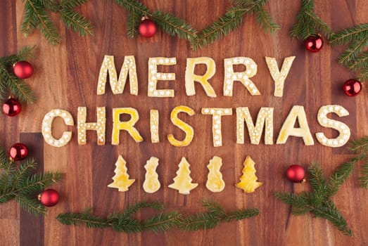 the words merry christmas with christmas decorations