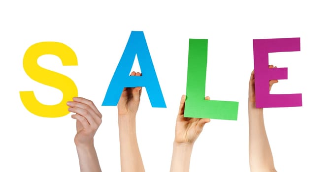 some hands holding letters building the word sale, isolated
