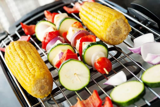 a barbecue with some vegetarian delicacies on it
