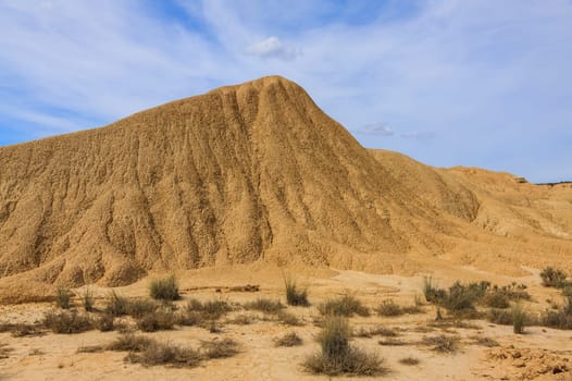 Desert landscape under the cloudy sky, Bardenas Reales, Navarra, Spain