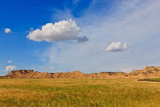Desert landscape under the cloudy sky, Bardenas Reales, Navarra, Spain
