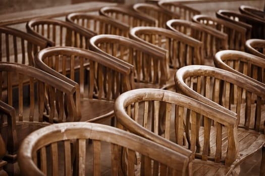 Old wooden chairs in the theater close up