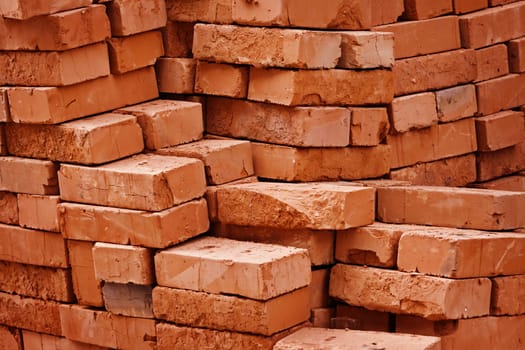 Construction material warehouse. Stack of bricks close up