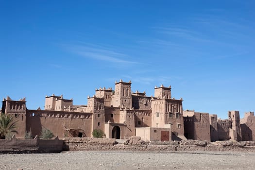Historical kasbah Amridil against blue sky, Morocco.