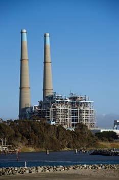 A huge factory shot against a natural background