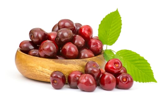 fresh cherries in a bowl on white background