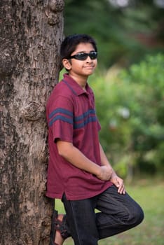 Handsome Indian toddler standing outdoor smiling