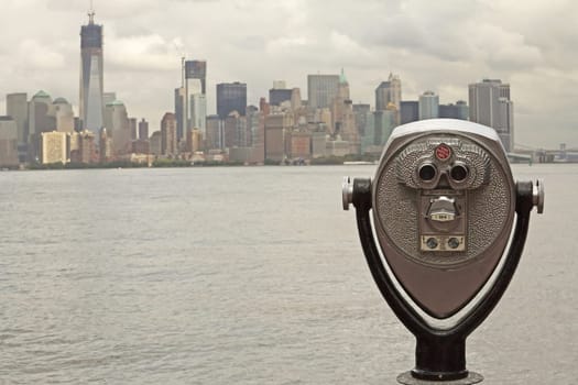 Coin operated binoculars with Lower Manhattan on the background (New York City)