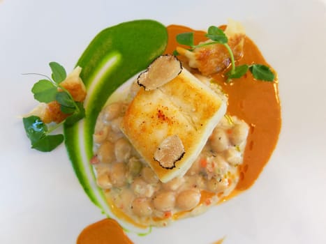 Fish main course on a white plate
