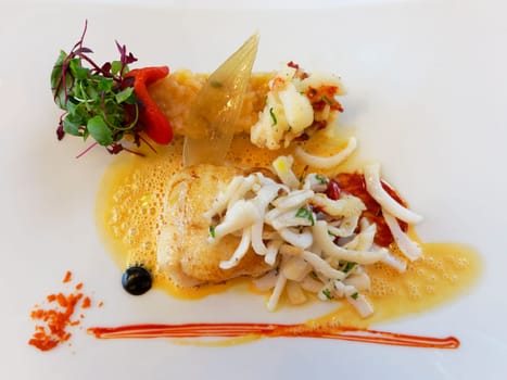 Fish main course on a white plate